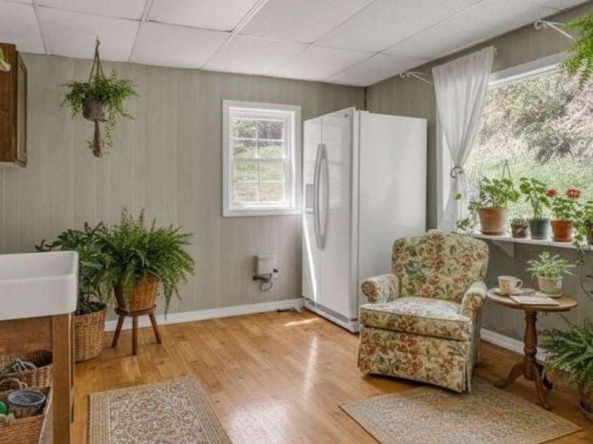 228 Vilas Overlook Drive, Vilas, NC 28692.  MLS# CAR4369701, YatesRealty ID 12269. Staged Laundry / Sunroom