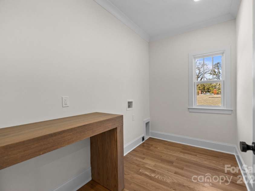 1824 Haines Street, Charlotte, NC 28216.  MLS# CAR4222128, YatesRealty ID 12278. Laundry room with custom folding table