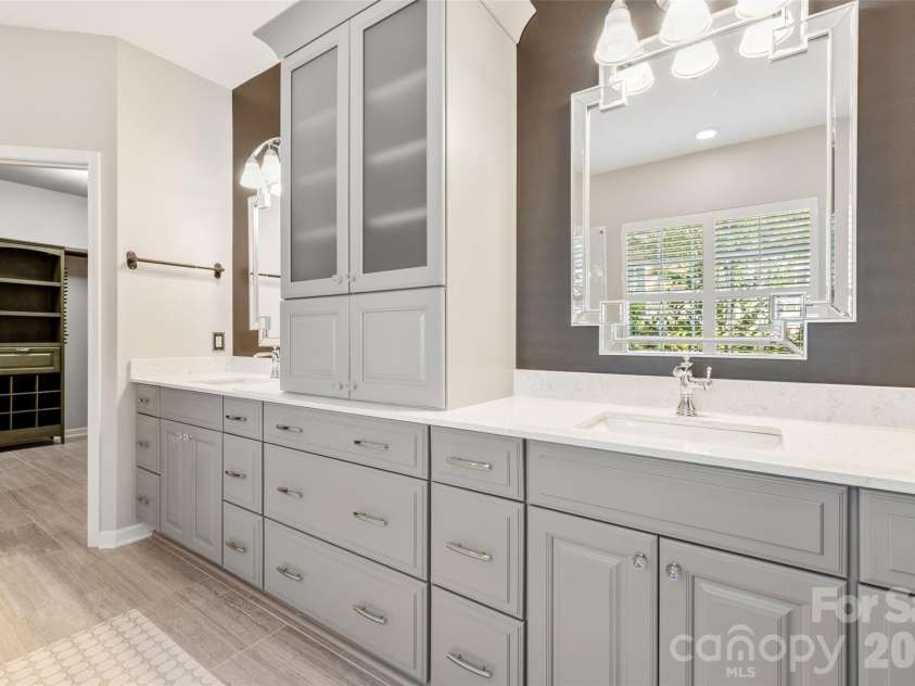 9332 Whistling Straits Drive, Fort Mill, SC 29707.  MLS# CAR4332758, YatesRealty ID 12280. Primary bath has double sinks, updated cabints and storage