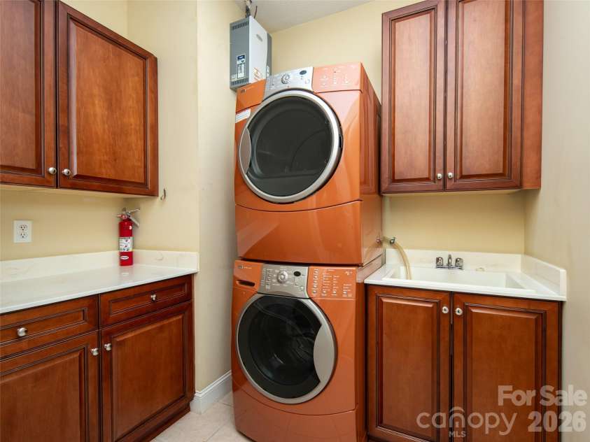 124 Towne Place Drive, Hendersonville, NC 28792.  MLS# CAR4364693, YatesRealty ID 12282. Main level laundry