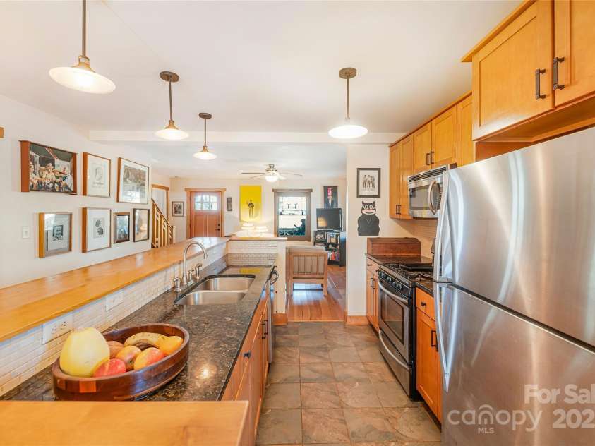 14 Drake Street, Asheville, NC 28806.  MLS# CAR4220997, YatesRealty ID 12283. Kitchen looking towards living room.