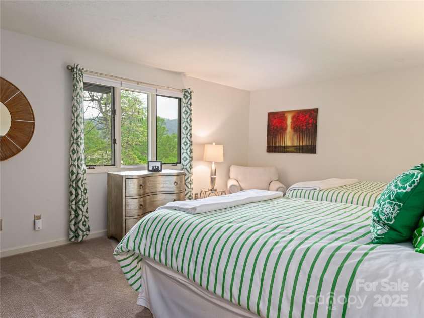 1901 Timber Trail, Asheville, NC 28804.  MLS# CAR4252207, YatesRealty ID 12288. Guest Bedroom on lower level offering privacy and long range mountain views.