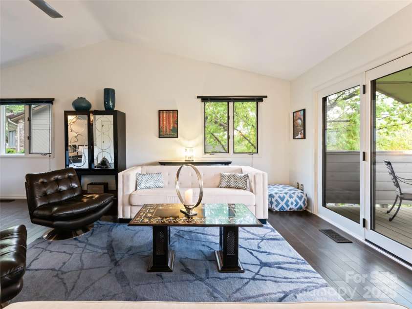 1901 Timber Trail, Asheville, NC 28804.  MLS# CAR4252207, YatesRealty ID 12288. Large Great Room overlooking covered deck and long range mountain views.