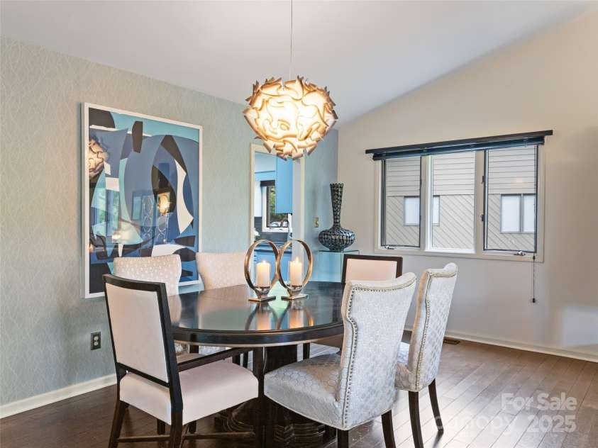 1901 Timber Trail, Asheville, NC 28804.  MLS# CAR4252207, YatesRealty ID 12288. Sophisticated open dining area with room for large dinner parties. Triple window allows for natural light .