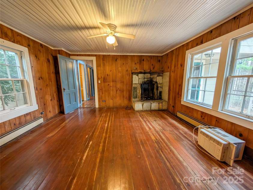 51 Woodland Hills Drive, Burnsville, NC 28714.  MLS# CAR4208375, YatesRealty ID 12290. Please note wood flooring in this room is soft in places. There are currently no inspection reports or known reason for floor condition. Thorough inspection is needed.