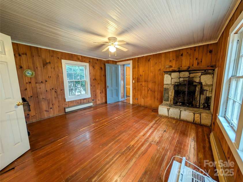 51 Woodland Hills Drive, Burnsville, NC 28714.  MLS# CAR4208375, YatesRealty ID 12290. Please note wood flooring in this room is soft in places. There are currently no inspection reports or known reason for floor condition. Thorough inspection is needed.