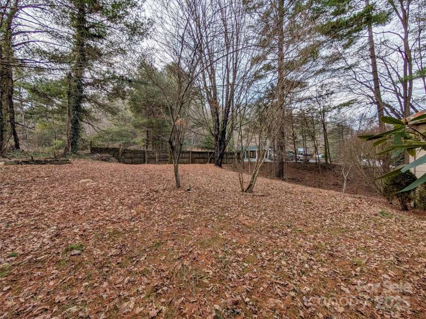 51 Woodland Hills Drive, Burnsville, NC 28714.  MLS# CAR4208375, YatesRealty ID 12290. Winter View of acreage front portion of property
