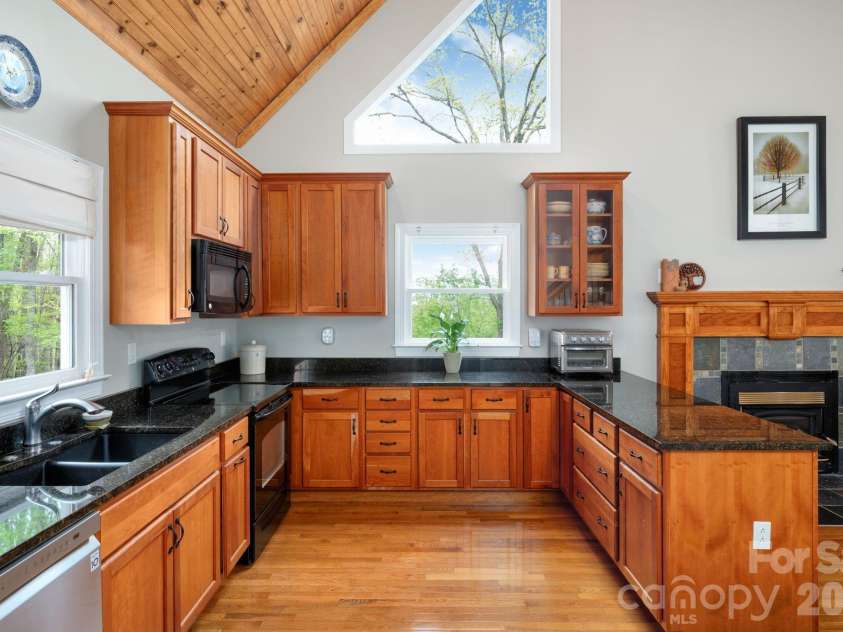 69 Heslar Way, Marshall, NC 28753.  MLS# CAR4345073, YatesRealty ID 12294. Chef's kitchen with natural cherry cabinets 