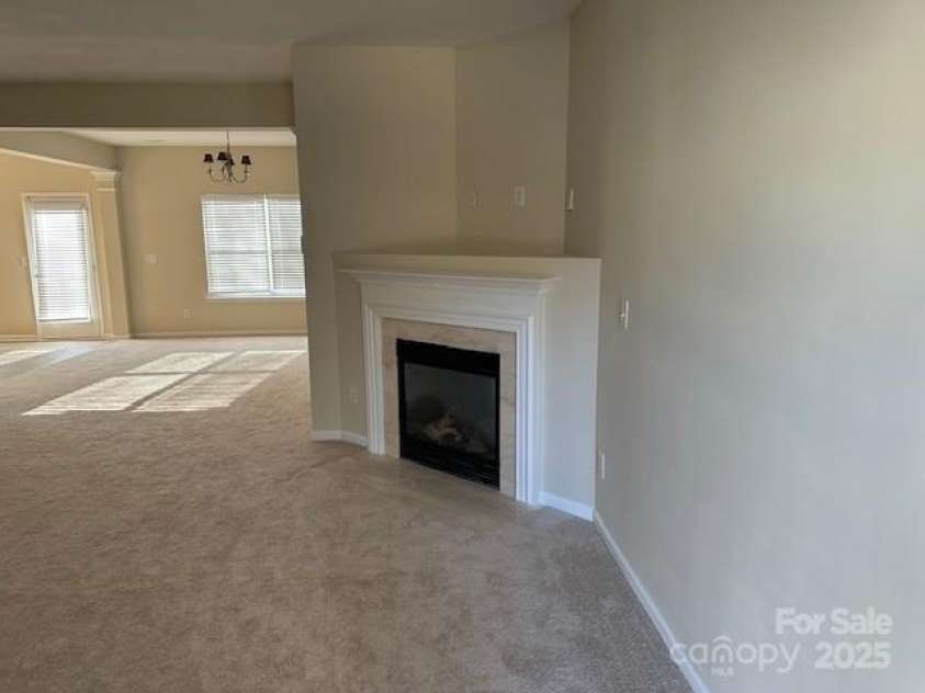 15200 Chowning Tavern Lane, Charlotte, NC 28262.  MLS# CAR4226810, YatesRealty ID 1230. Great Room/ Fireplace