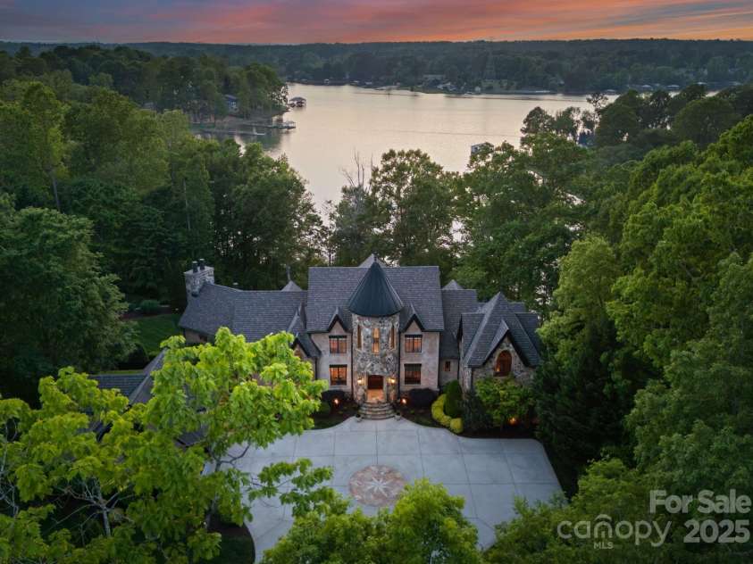 172 Tennessee Circle, Mooresville, NC 28117.  MLS# CAR4252701, YatesRealty ID 1230. Aerial view of the home featuring stunning views of Lake Norman. 