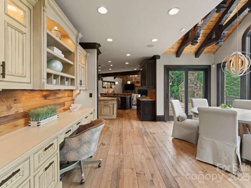 172 Tennessee Circle, Mooresville, NC 28117.  MLS# CAR4252701, YatesRealty ID 1230. Desk area between the kitchen and living room featuring custom cabinetry. 