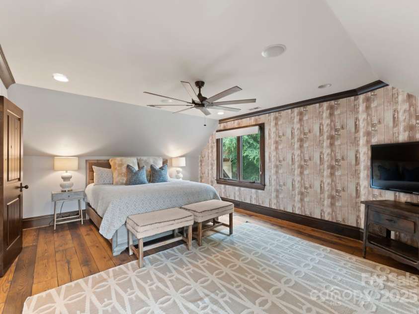 172 Tennessee Circle, Mooresville, NC 28117.  MLS# CAR4252701, YatesRealty ID 1230. Each Guest Bedroomfeatures TVs, fans, and wallpaper.