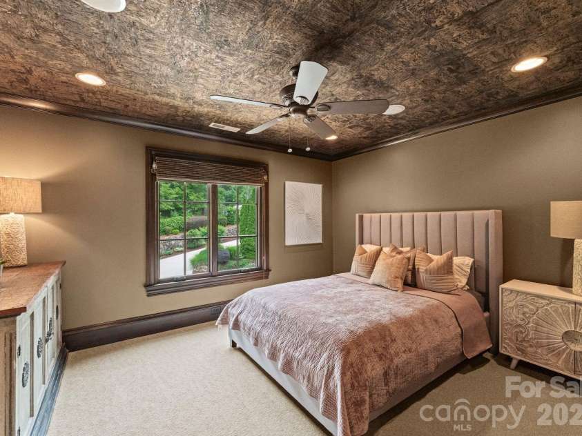 172 Tennessee Circle, Mooresville, NC 28117.  MLS# CAR4252701, YatesRealty ID 1230. Each Guest Bedroomfeatures TVs, fans, and wallpaper.