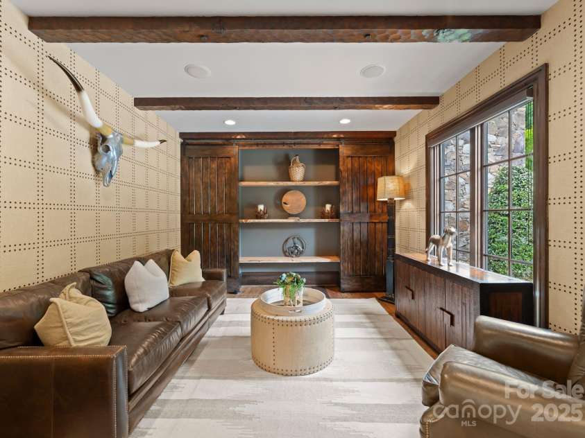 172 Tennessee Circle, Mooresville, NC 28117.  MLS# CAR4252701, YatesRealty ID 1230. Flexible office/sitting room with hidden shelving and laundry access.