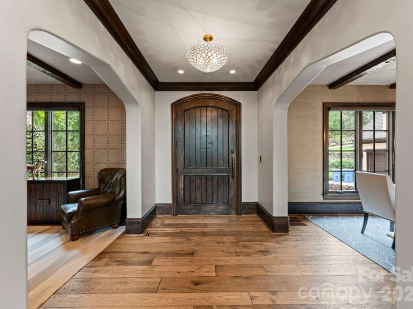 172 Tennessee Circle, Mooresville, NC 28117.  MLS# CAR4252701, YatesRealty ID 1230. Grand foyer with wood door and access to main living.