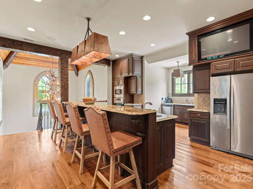 172 Tennessee Circle, Mooresville, NC 28117.  MLS# CAR4252701, YatesRealty ID 1230. Guest Apartment Kitchenis fully equipped with GE Profile appliances and custom cabinetry.