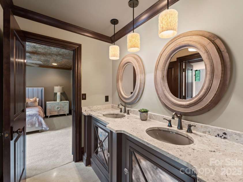 172 Tennessee Circle, Mooresville, NC 28117.  MLS# CAR4252701, YatesRealty ID 1230. Jack-and-jill bathroom featuring dual vanities, an oversized walk-in shower and private water closet. 