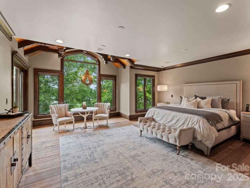 172 Tennessee Circle, Mooresville, NC 28117.  MLS# CAR4252701, YatesRealty ID 1230. Primary suite is an elegant main-level retreat with lake views and private patio.