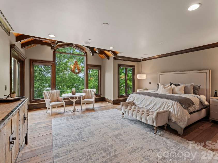 172 Tennessee Circle, Mooresville, NC 28117.  MLS# CAR4252701, YatesRealty ID 1230. Primary suite is an elegant main-level retreat with lake views and private patio.