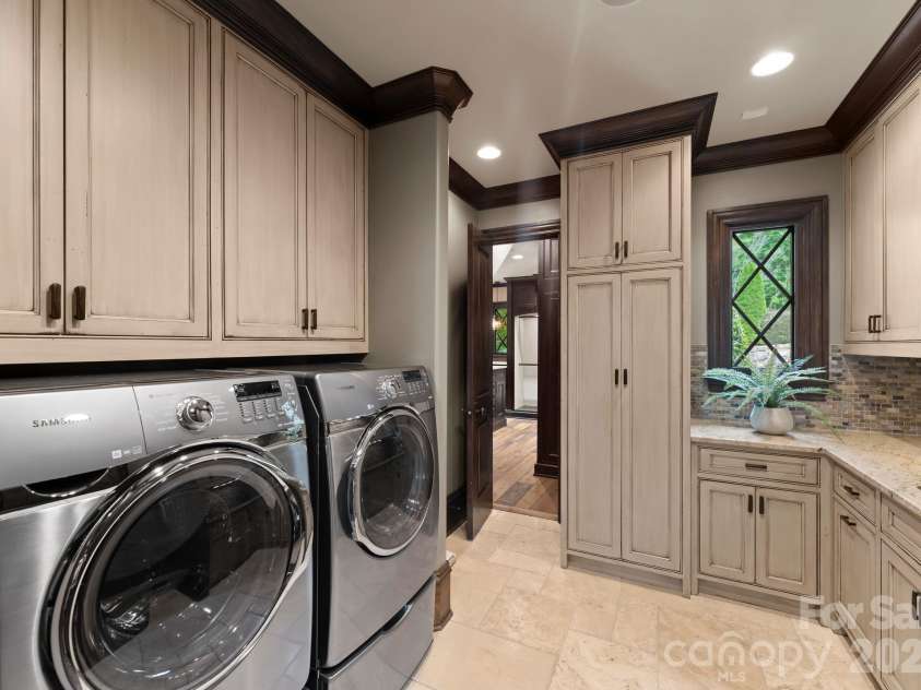 172 Tennessee Circle, Mooresville, NC 28117.  MLS# CAR4252701, YatesRealty ID 1230. Spacious Laundry Room with sink, storage, and folding counter.