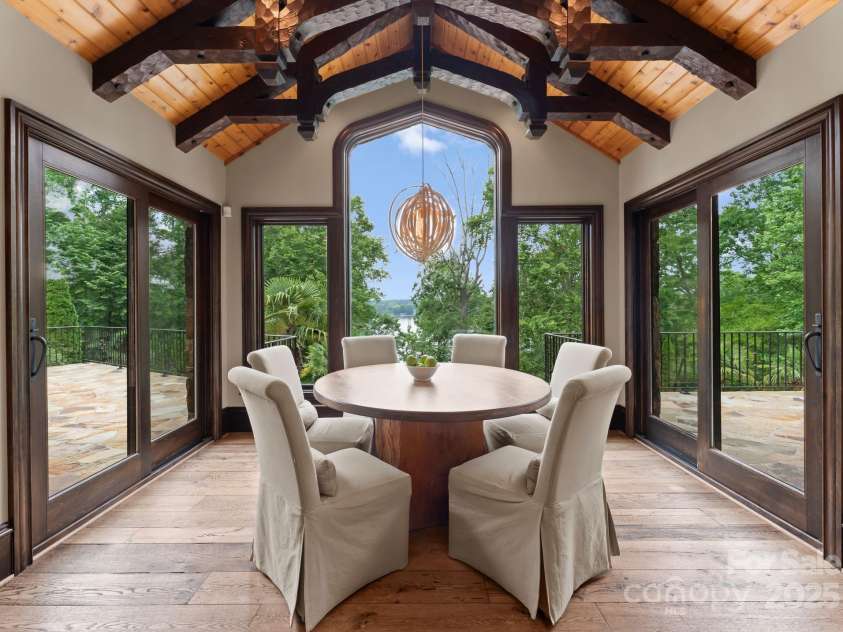 172 Tennessee Circle, Mooresville, NC 28117.  MLS# CAR4252701, YatesRealty ID 1230. Sunlit breakfast area surrounded by lake views and glass doors.