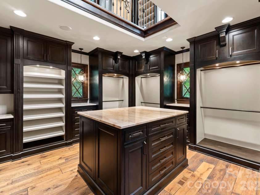 172 Tennessee Circle, Mooresville, NC 28117.  MLS# CAR4252701, YatesRealty ID 1230. Two-story boutique closet with light-filled luxury storage.