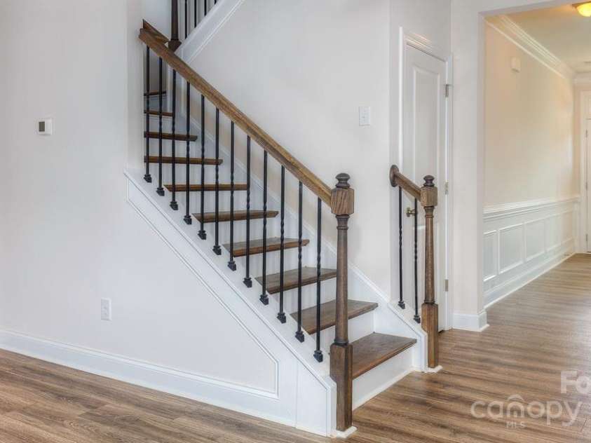 546 Fox Cove Road, Hendersonville, NC 28792.  MLS# CAR4200624, YatesRealty ID 12313. Stairs from family room to bedrooms