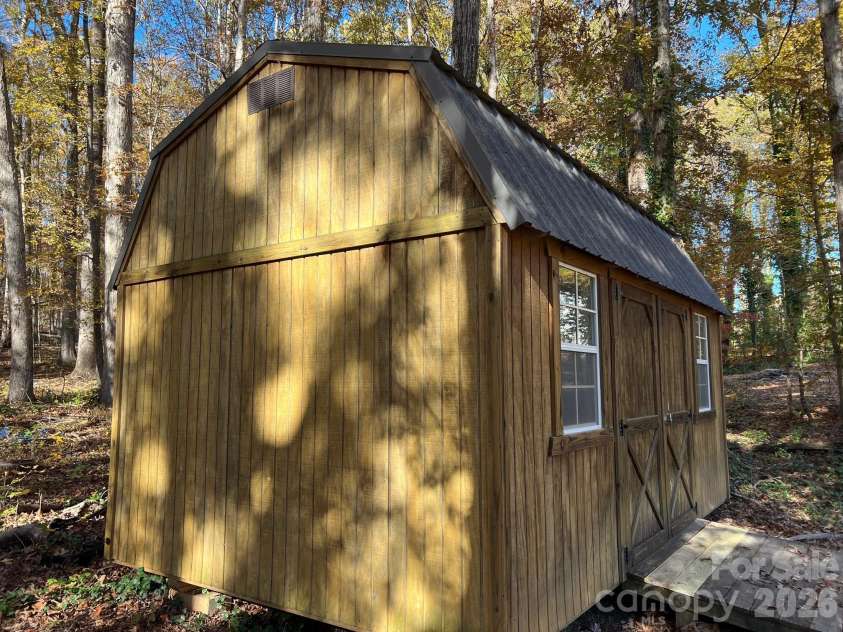 120 Oakley Drive, Gastonia, NC 28052.  MLS# CAR4317380, YatesRealty ID 12318. Barn style storage building in backyard 