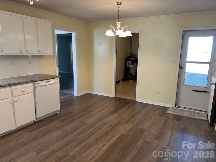 120 Oakley Drive, Gastonia, NC 28052.  MLS# CAR4317380, YatesRealty ID 12318. Kitchen and breakfast area.  Door to the carport and the laundry room plus pantry 