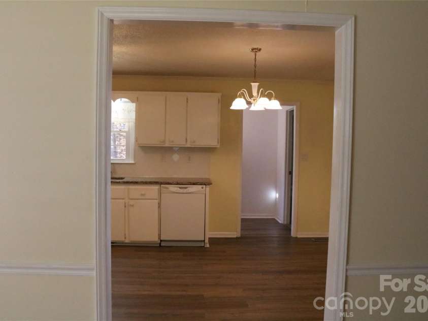 120 Oakley Drive, Gastonia, NC 28052.  MLS# CAR4317380, YatesRealty ID 12318. Living room into the spacious kitchen and dining area 