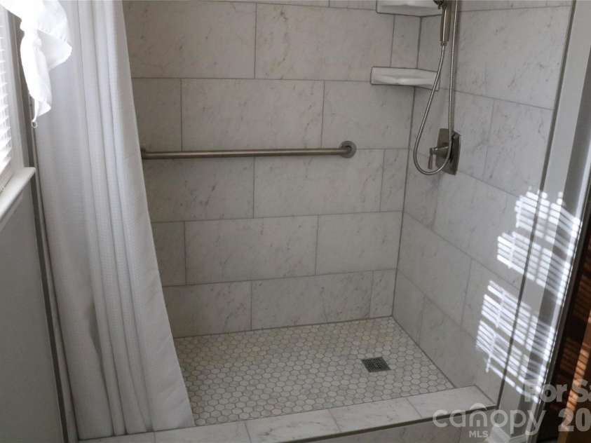 120 Oakley Drive, Gastonia, NC 28052.  MLS# CAR4317380, YatesRealty ID 12318. Tiled shower with stone tiled floors - handicap accessible 