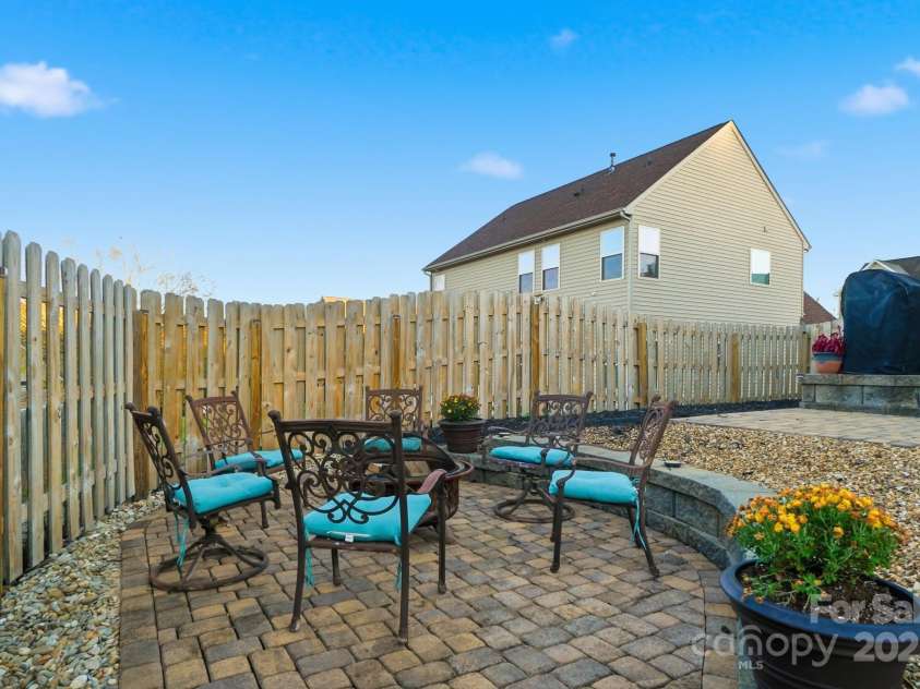 167 Gage Drive, Mooresville, NC 28115.  MLS# CAR4314236, YatesRealty ID 12324. Well-designed private backyard includes professionally installed pavers, hot tub, storage building, hard top gazebo w/sun screens, fire pit and outdoor furniture all convey with an acceptable offer!