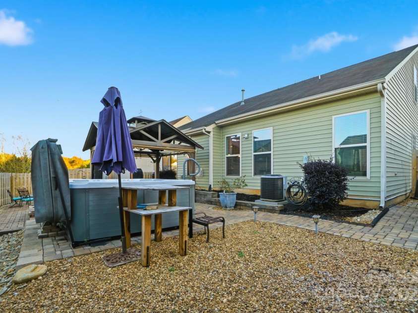 167 Gage Drive, Mooresville, NC 28115.  MLS# CAR4314236, YatesRealty ID 12324. Well-designed private backyard includes professionally installed pavers, hot tub, storage building, hard top gazebo w/sun screens, fire pit and outdoor furniture all convey with an acceptable offer!