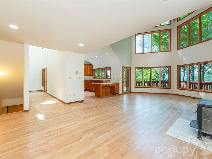 7 Winding Poplar Road, Black Mountain, NC 28711.  MLS# CAR4285345, YatesRealty ID 12326. Soapstone wood burning stove for Fall and Winter evenings.