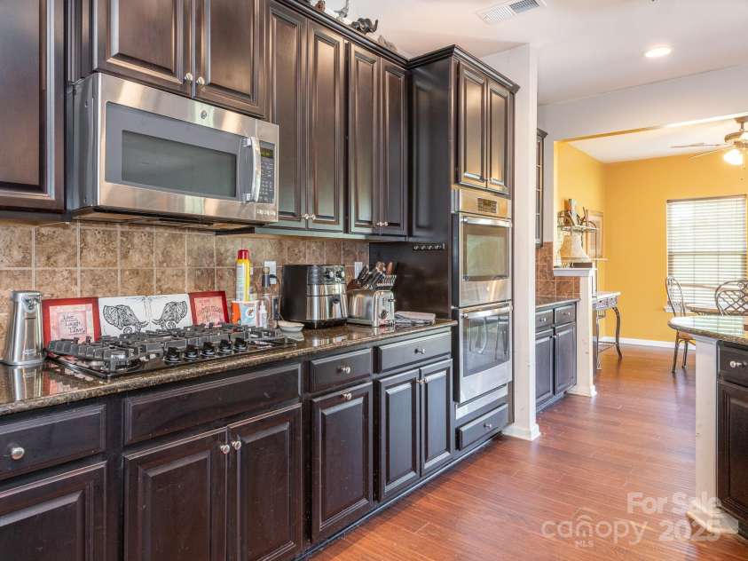 1691 Mill Creek Lane, Concord, NC 28025.  MLS# CAR4192669, YatesRealty ID 12329. Kitchen into Dining Room
