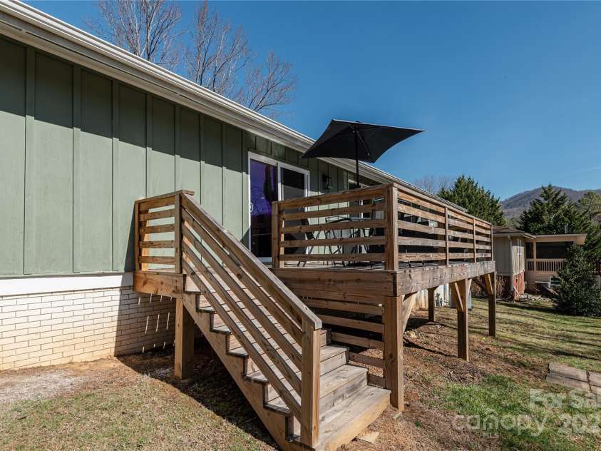 7 Brookcliff Drive, Asheville, NC 28804.  MLS# CAR4224301, YatesRealty ID 12337. Stairs up to back deck