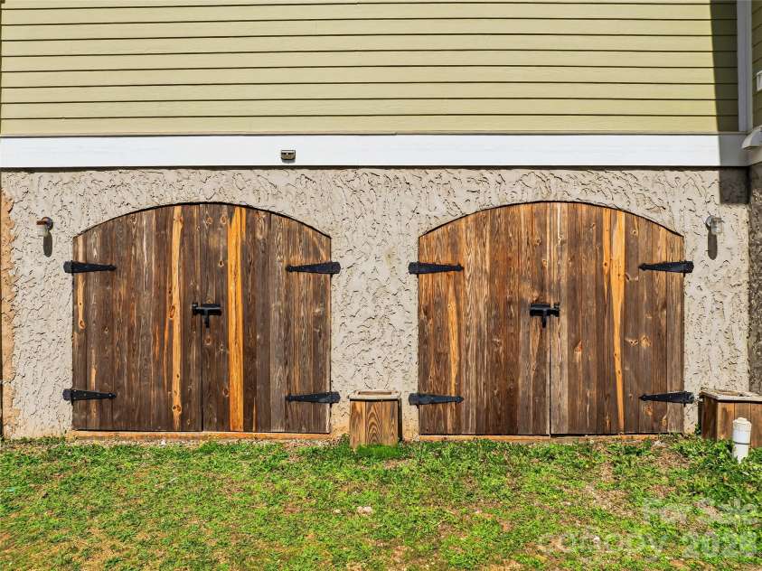 196 Blackbird Lane, Tryon, NC 28782.  MLS# CAR4366022, YatesRealty ID 12349. Extra Storage Under Garage