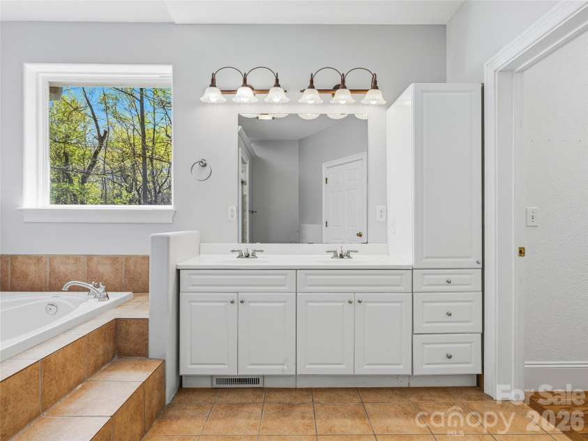 196 Blackbird Lane, Tryon, NC 28782.  MLS# CAR4366022, YatesRealty ID 12349. Primary Bathroom with Double Vanity
