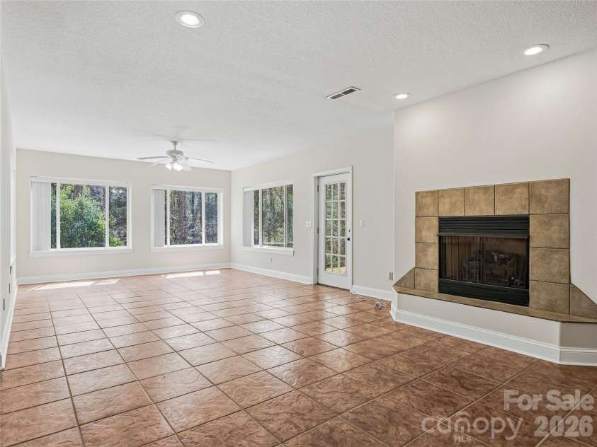 196 Blackbird Lane, Tryon, NC 28782.  MLS# CAR4366022, YatesRealty ID 12349. Walkout basement with Gas Fireplace