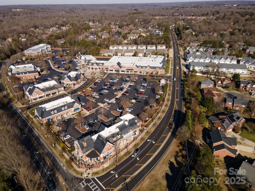 7908 Rea View Court, Charlotte, NC 28226.  MLS# CAR4257499, YatesRealty ID 12354. Aerial view showing Colony Place shopping center and surrounding area. There is a crosswalk to get to the shopping center from the Rea Court.