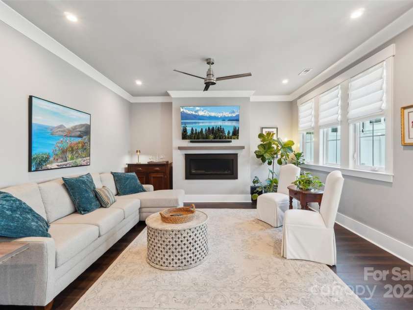7908 Rea View Court, Charlotte, NC 28226.  MLS# CAR4257499, YatesRealty ID 12354. Great Room with sleek fireplace and large windows.