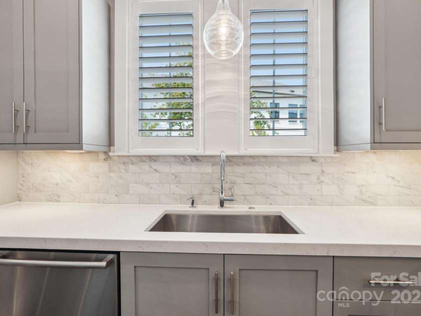 7908 Rea View Court, Charlotte, NC 28226.  MLS# CAR4257499, YatesRealty ID 12354. Kitchen sink with large window, shutters