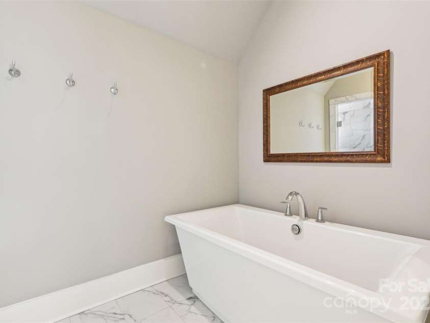 7908 Rea View Court, Charlotte, NC 28226.  MLS# CAR4257499, YatesRealty ID 12354. Upstairs Primary Bathroom free standing tub