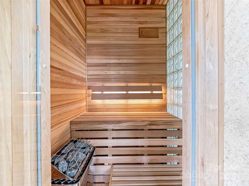 10 Beaverbrook Court, Asheville, NC 28804.  MLS# CAR4246277, YatesRealty ID 1236. Cedar sauna that is half glass to allows the light in.