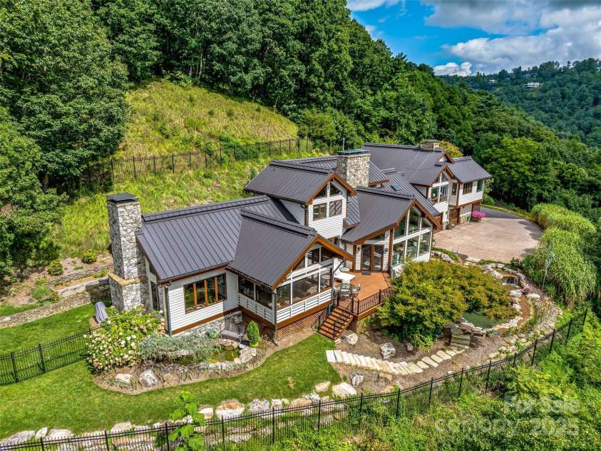 10 Beaverbrook Court, Asheville, NC 28804.  MLS# CAR4246277, YatesRealty ID 1236. Eight foot iron fence surrounds the house is perfect for your four legged family members