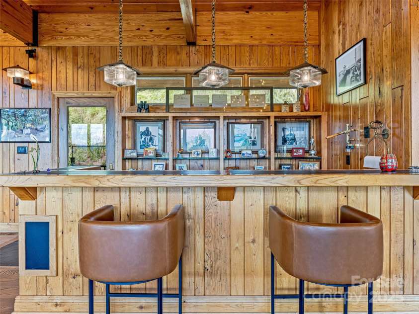 10 Beaverbrook Court, Asheville, NC 28804.  MLS# CAR4246277, YatesRealty ID 1236. Family room wet bar