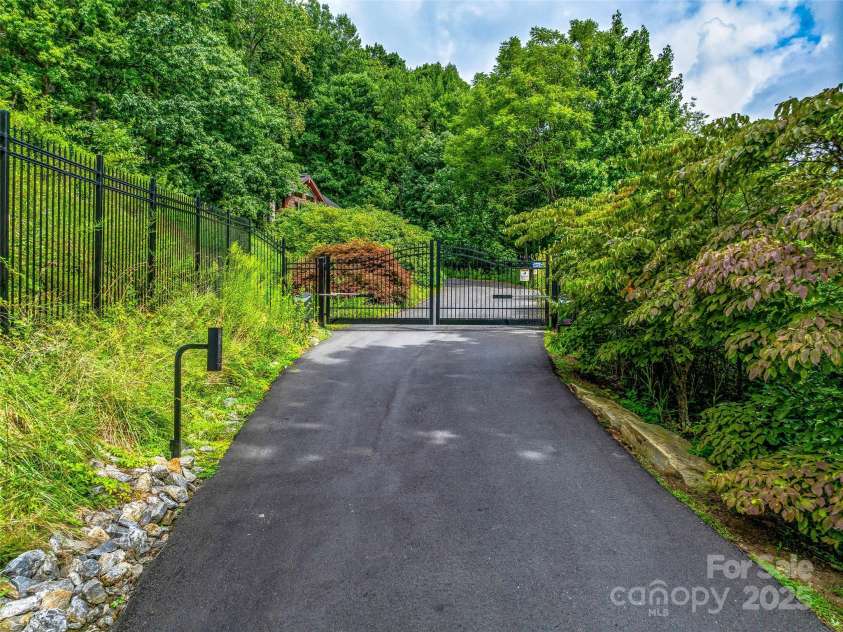 10 Beaverbrook Court, Asheville, NC 28804.  MLS# CAR4246277, YatesRealty ID 1236. Internet monitored and controlled security gate provides privacy.