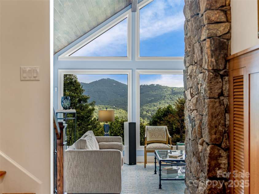 10 Beaverbrook Court, Asheville, NC 28804.  MLS# CAR4246277, YatesRealty ID 1236. Living room has a wall of windows