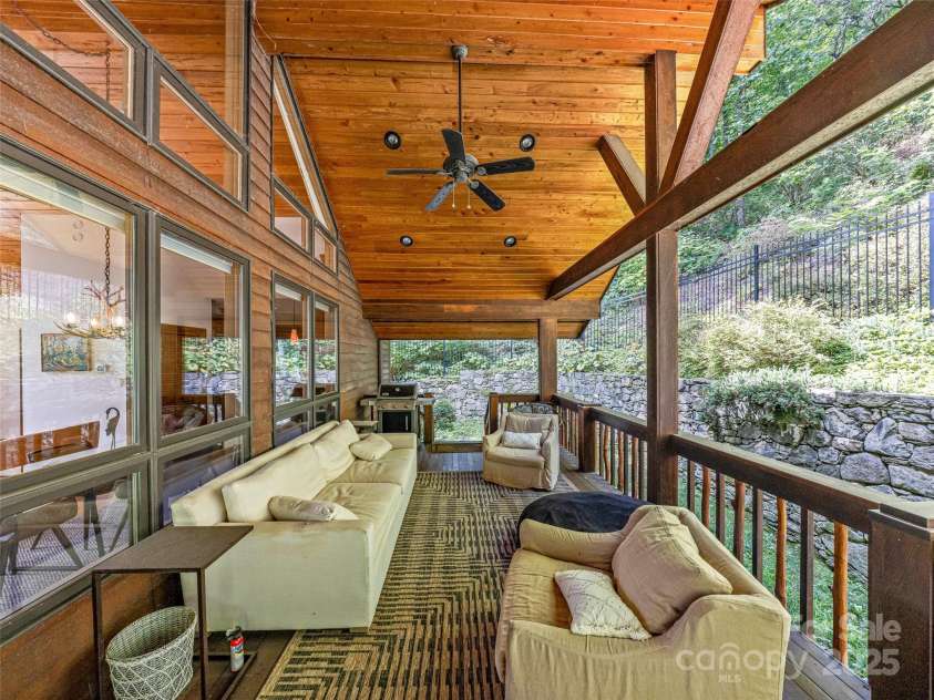 10 Beaverbrook Court, Asheville, NC 28804.  MLS# CAR4246277, YatesRealty ID 1236. Private covered porch in the fenced yard is a great place to relax.