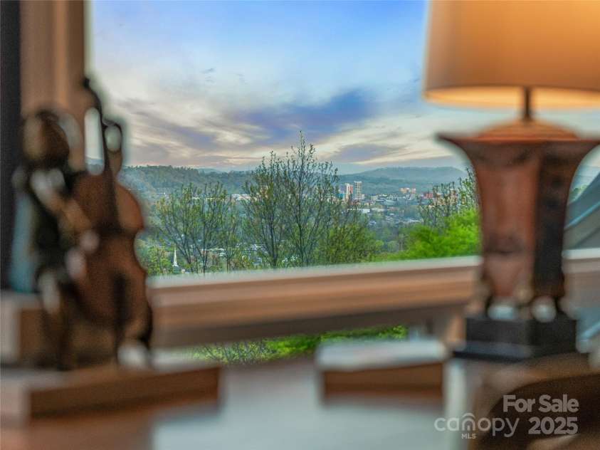 10 Beaverbrook Court, Asheville, NC 28804.  MLS# CAR4246277, YatesRealty ID 1236. View of downtown AVL from sitting room
